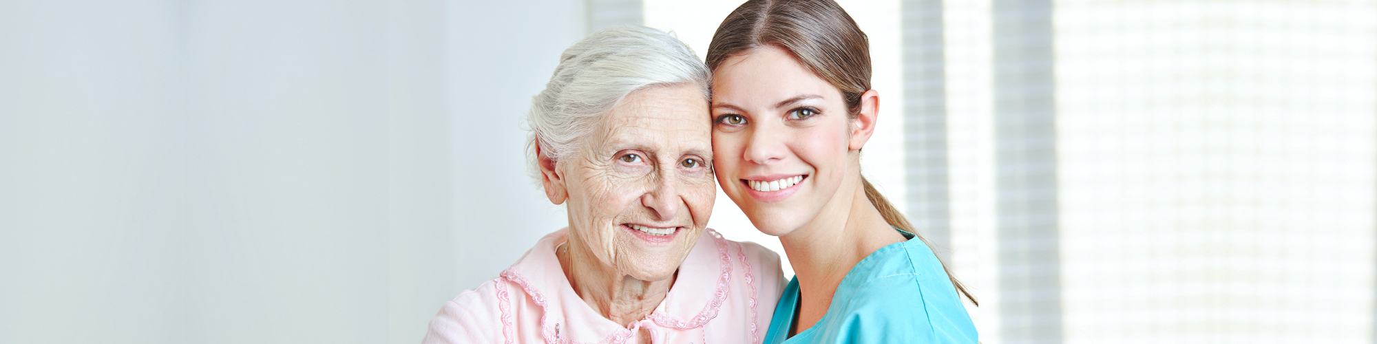 caregiver and senior smiling
